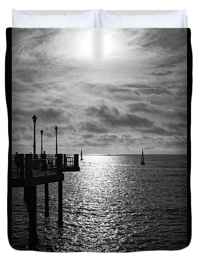 Sun Duvet Cover featuring the photograph Pier into the Sun by Michael Hope