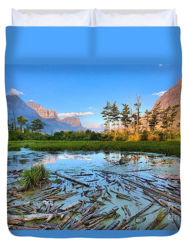 St Mary Lake Duvet Cover featuring the photograph Pink Peaks Over Driftwood by Adam Jewell
