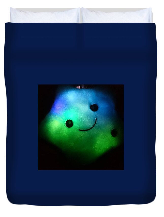A Light In The Dark Duvet Cover featuring the photograph A Smiling light in the dark by Sarah Qua