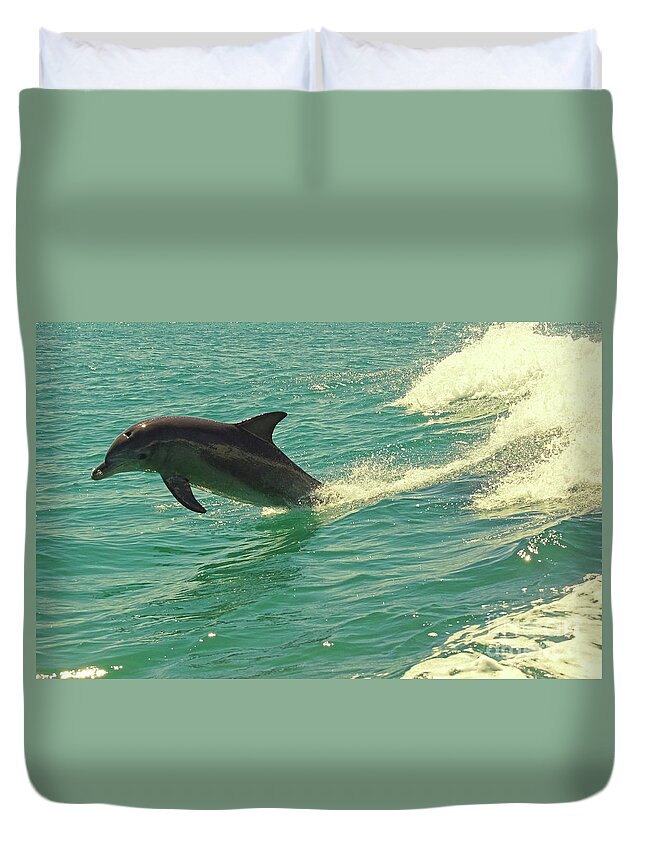 Dolphin Duvet Cover featuring the photograph Ride the Wave by Cassandra Buckley