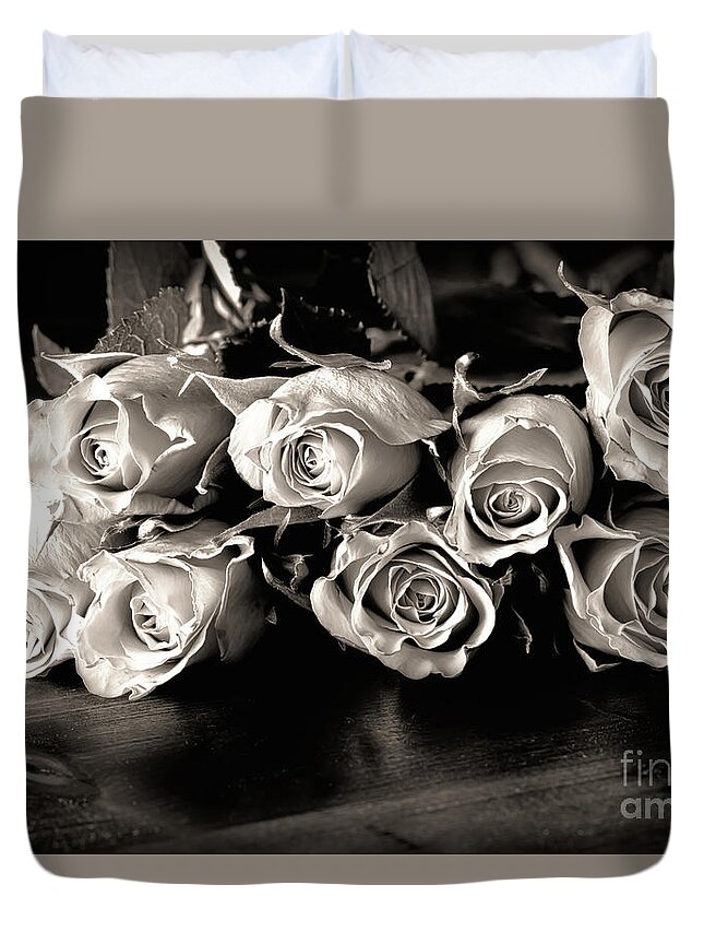 Roses Duvet Cover featuring the photograph Roses on a table in black and white by Simon Bratt