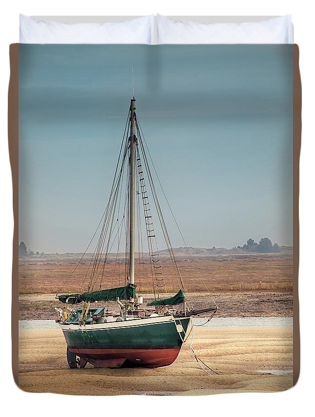 Wells Duvet Cover featuring the photograph Norfolk sail boat stranded at low tide by Simon Bratt
