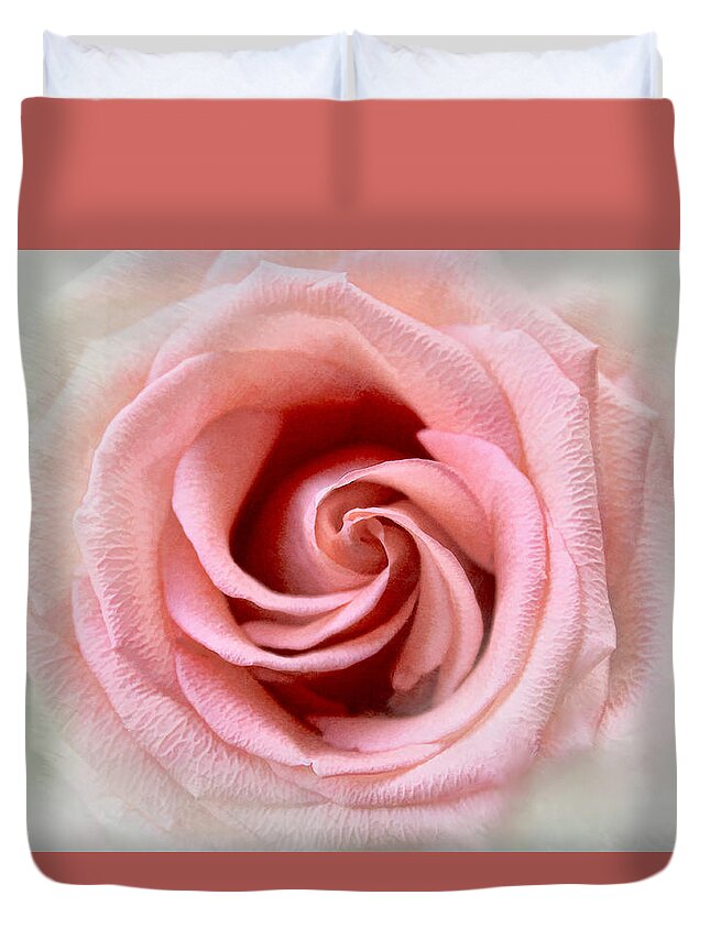 Rose Duvet Cover featuring the photograph Spinning Coral Rose by Bonnie Willis