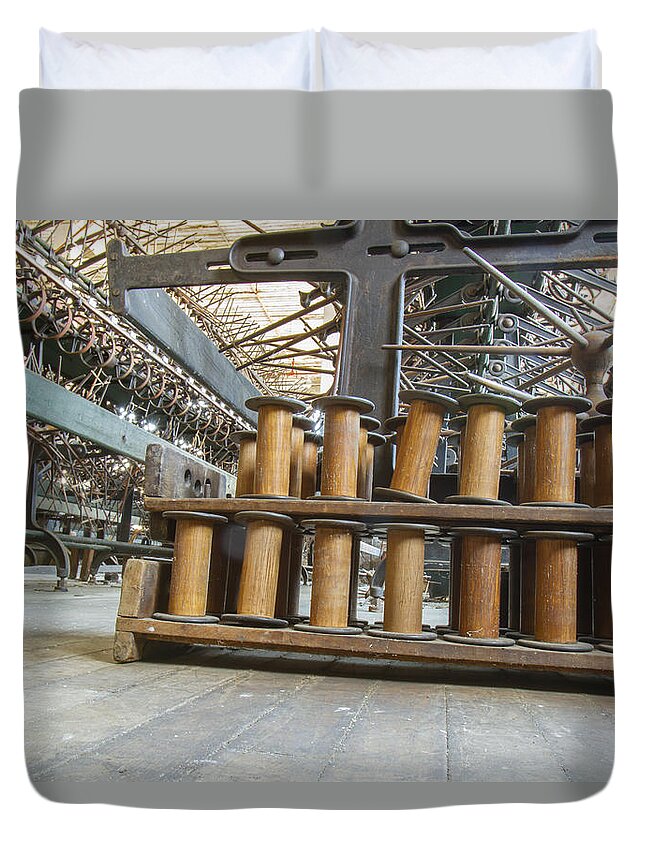 Abandoned Duvet Cover featuring the photograph Spools and equipment in factory by Karen Foley