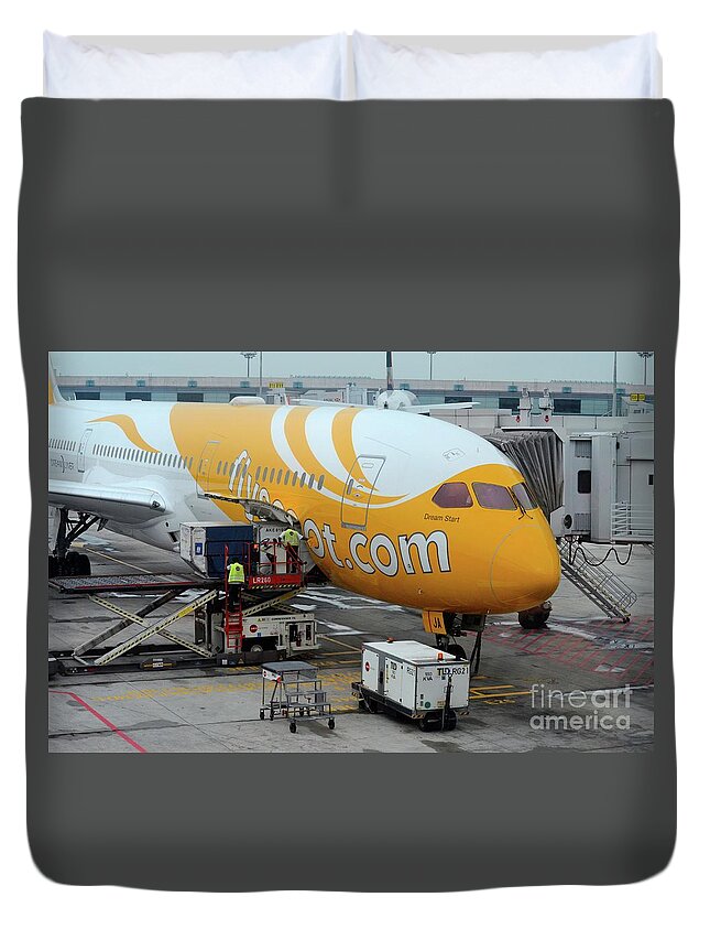 Airplane Duvet Cover featuring the photograph Stationary Scoot airline airplane serviced on Changi airport tarmac Singapore by Imran Ahmed