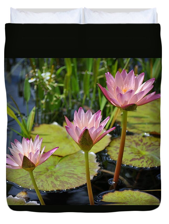 Floral Duvet Cover featuring the photograph Sunlit Water Lilies by Emerita Wheeling