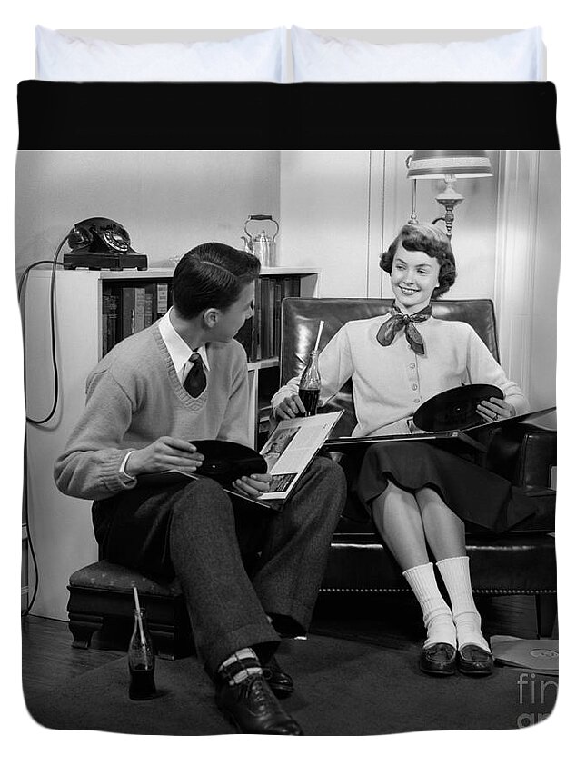 1950s Duvet Cover featuring the photograph Teen Couple Listening To Records by H. Armstrong Roberts/ClassicStock