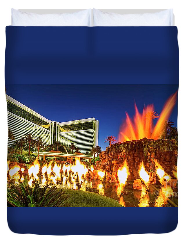 The Mirage Duvet Cover featuring the photograph The Mirage Casino and Volcano Eruption at Dusk by Aloha Art