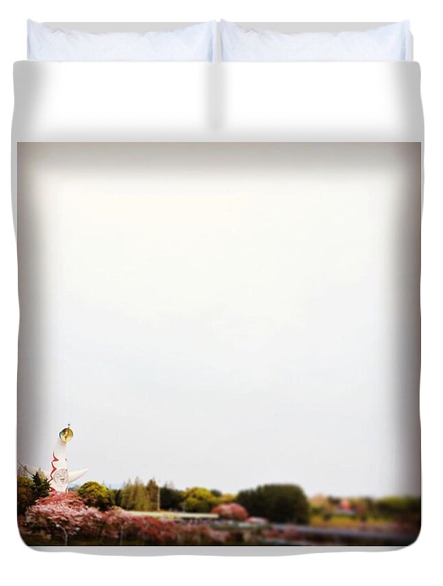pm} Duvet Cover featuring the photograph Tower of the Sun with Cherry Blossoms by Read Thread