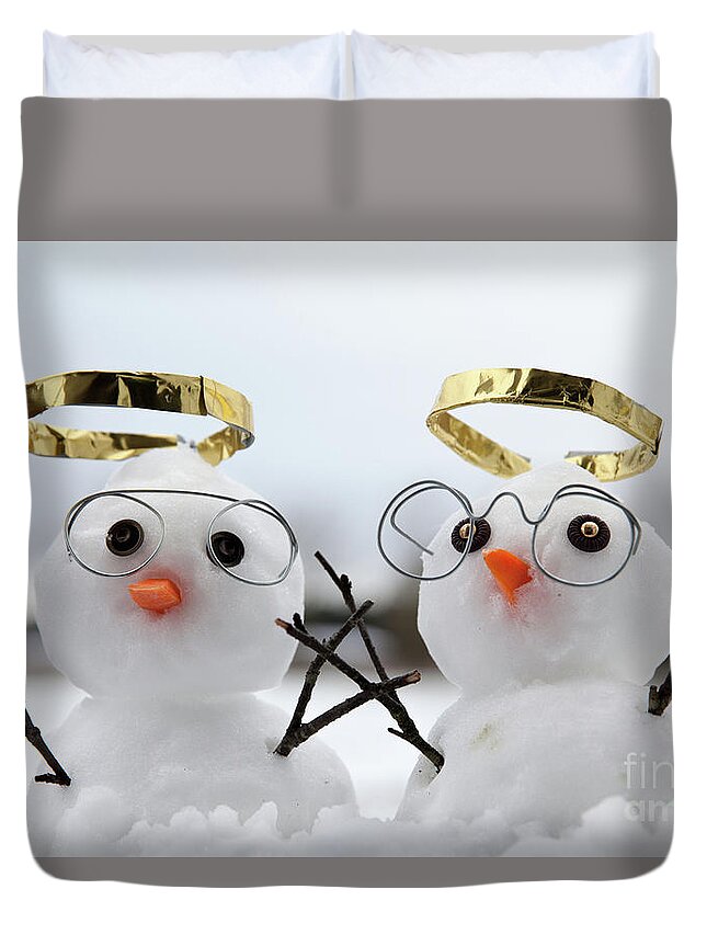 Snowmen Duvet Cover featuring the photograph Two cute snowman angles with golden halos by Simon Bratt