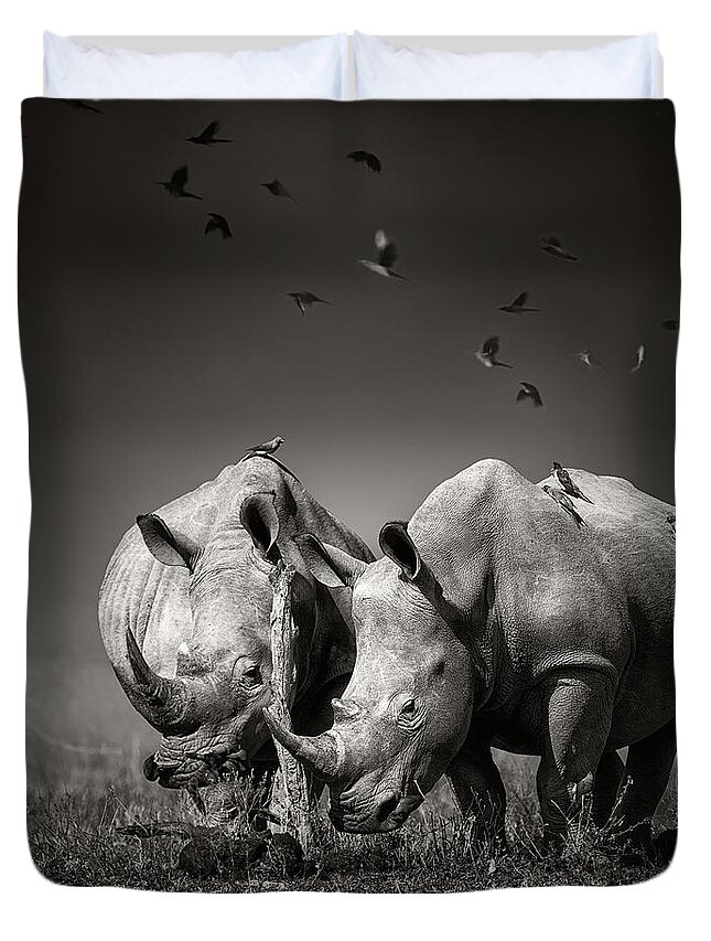 Rhinoceros Duvet Cover featuring the photograph Two Rhinoceros with birds in BW by Johan Swanepoel