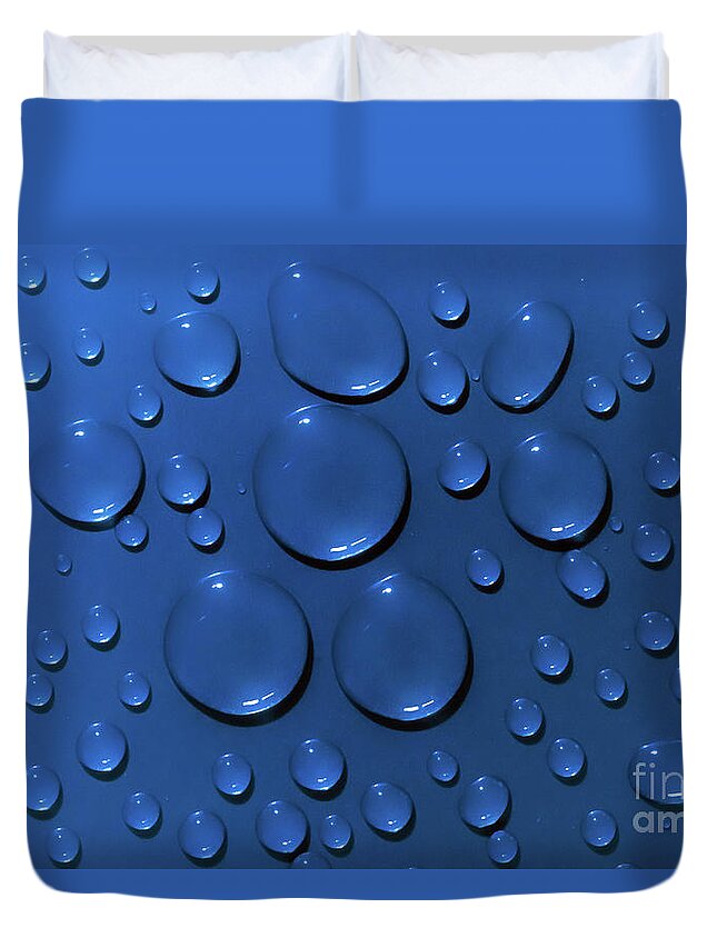 Water Duvet Cover featuring the photograph Water drops pattern on blue background by Simon Bratt