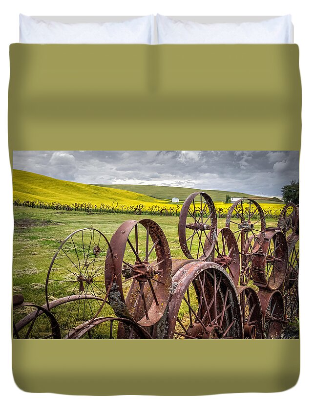 Wheel Duvet Cover featuring the photograph Wheel Fence and Canola Field by Brad Stinson