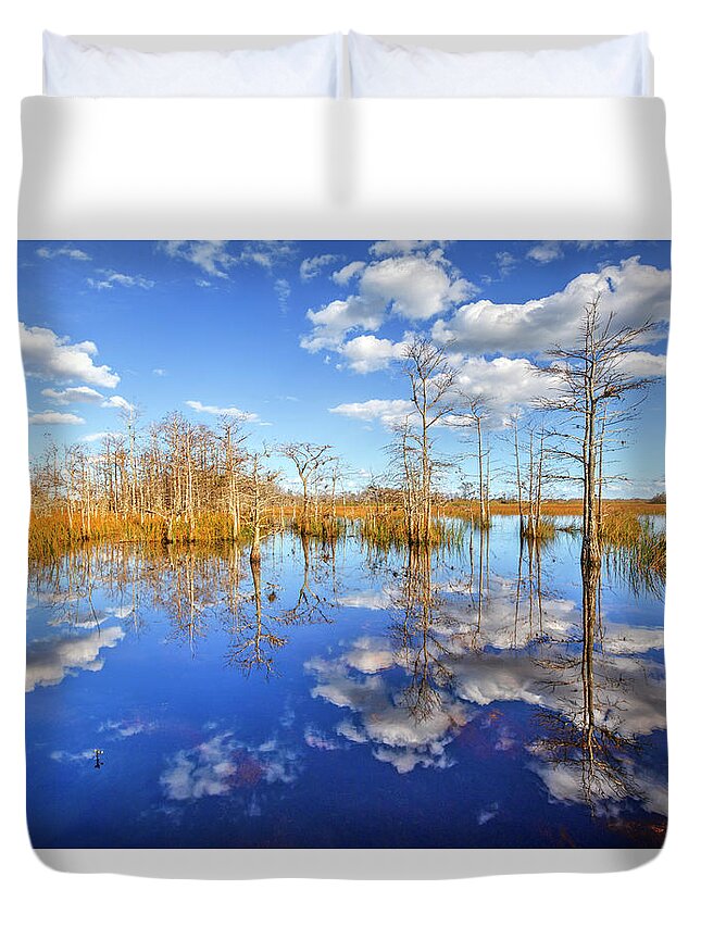 Clouds Duvet Cover featuring the photograph White Clouds over the Everglades by Debra and Dave Vanderlaan
