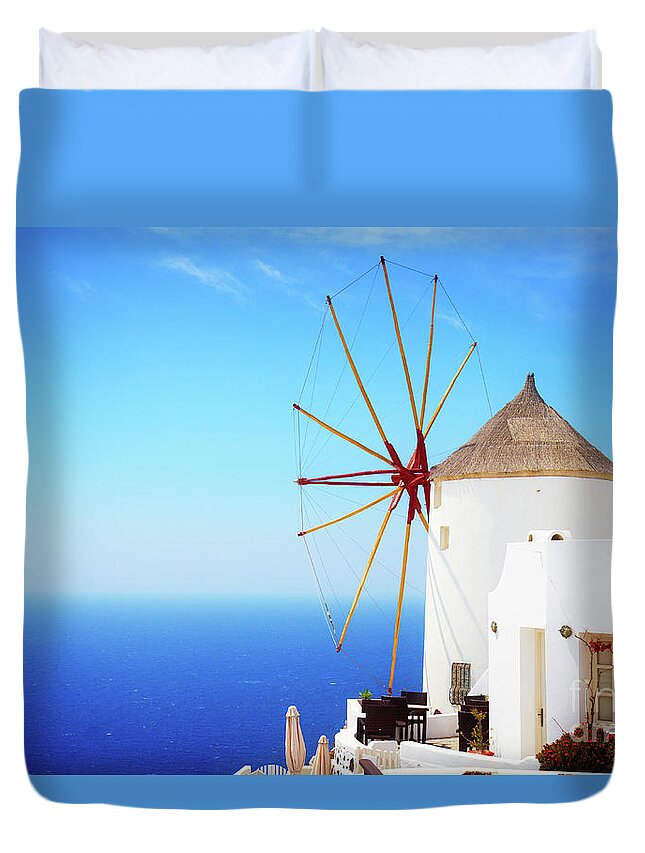 Santorini Duvet Cover featuring the photograph Windmill of Oia and Aegan Sea by Anastasy Yarmolovich