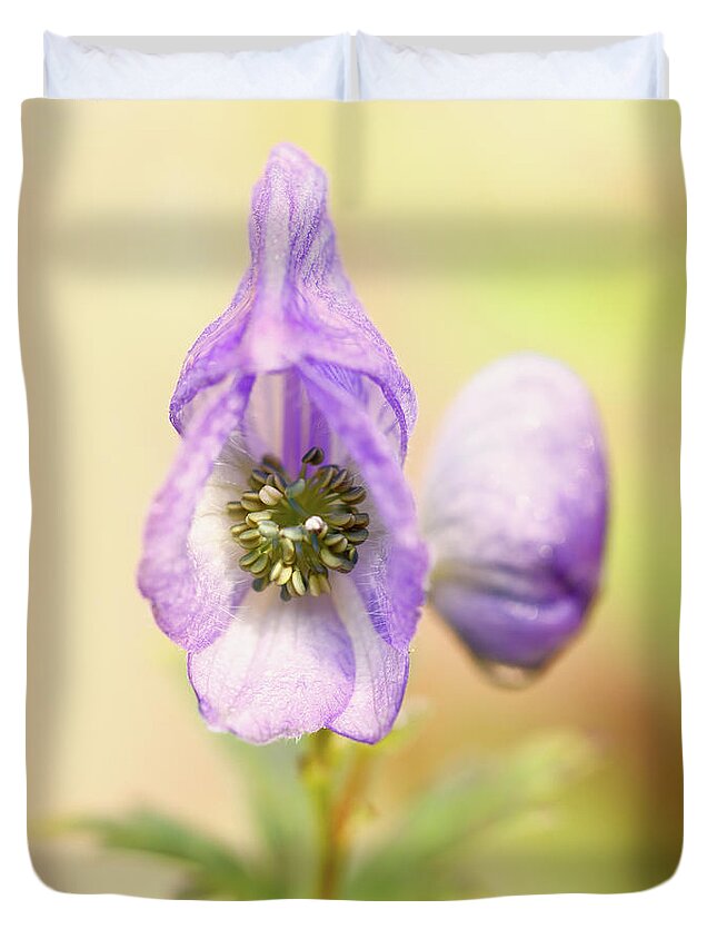 Flower Duvet Cover featuring the photograph Wolf's bane flower with pistils by Nick Biemans