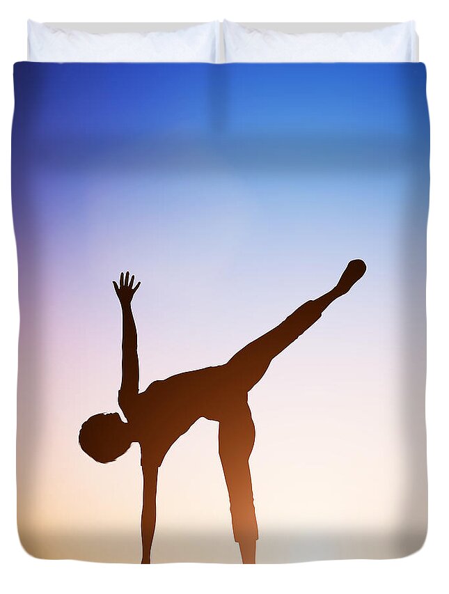 Yoga Duvet Cover featuring the photograph Woman in half moon yoga pose meditating at sunset by Michal Bednarek