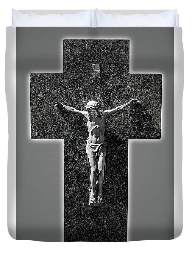 Jesus Christ Duvet Cover featuring the photograph Jesus Christ sculpture on a marble cross in black and white. #1 by Ulrich Wende