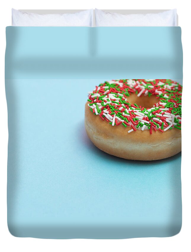 Unhealthy Eating Duvet Cover featuring the photograph A Donut With Sprinkles On A Blue by Steven Errico