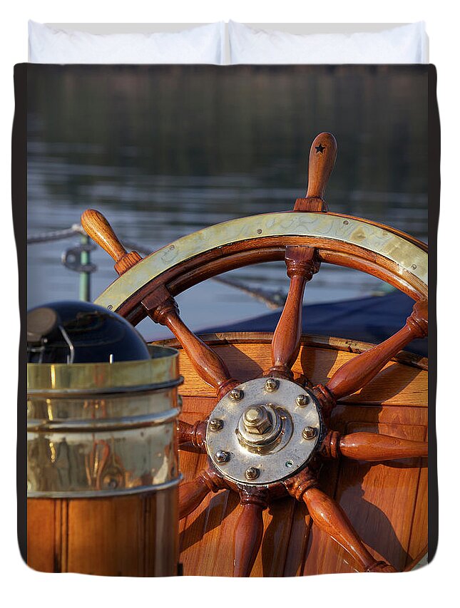 Recreational Pursuit Duvet Cover featuring the photograph A Warm Glow Highlights The Ships Wheel by Alison Langley