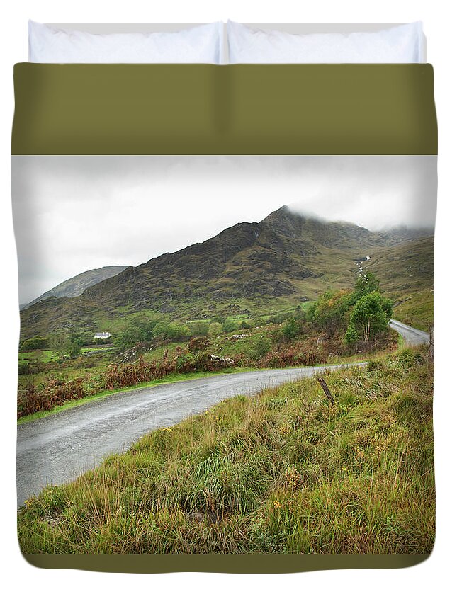 Curve Duvet Cover featuring the photograph A Winding Road Over A Hilly Landscape by John Kroetch / Design Pics