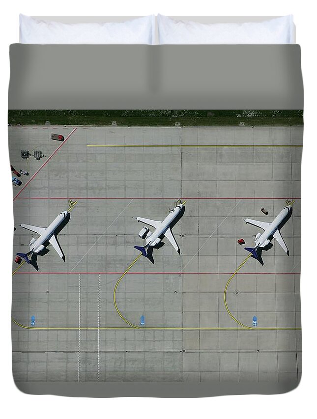 Shadow Duvet Cover featuring the photograph Aerial View Of A Row Of Airplanes Parked by Stephan Zirwes