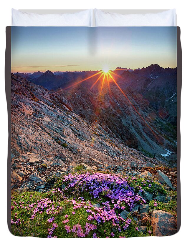 Scenics Duvet Cover featuring the photograph Alpine Sunrise With Flowers In The by Wingmar