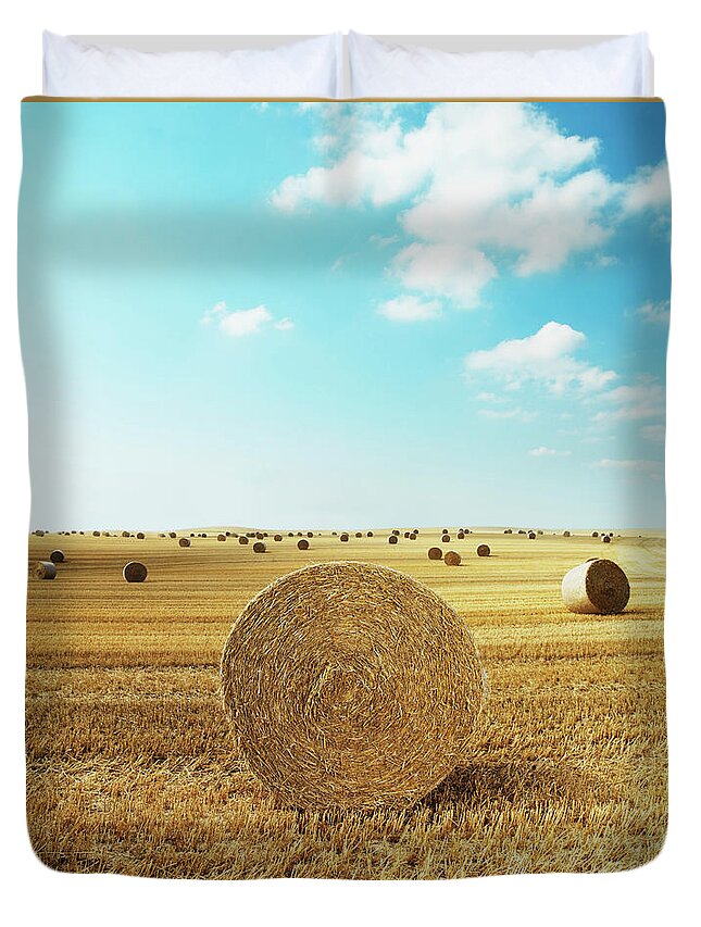 Field Stubble Duvet Cover featuring the photograph Bales Of Hay In Harvested Field by Henrik Sorensen