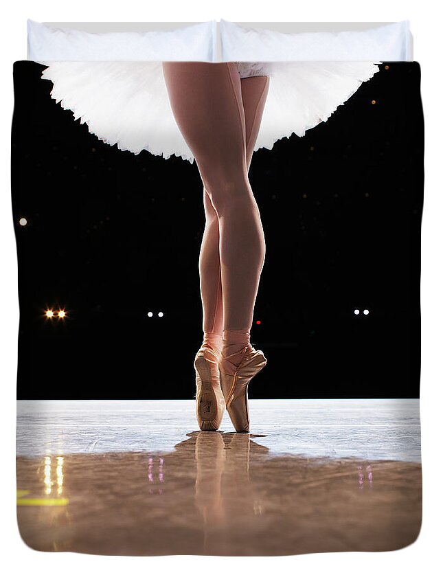 Ballet Dancer Duvet Cover featuring the photograph Ballerina En Pointe On Stage, Low by Thomas Barwick