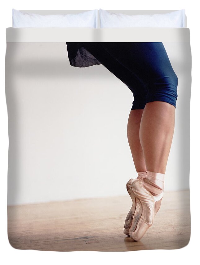 Ballet Dancer Duvet Cover featuring the photograph Ballet Dancer Balancing On Toes by Holly Harris