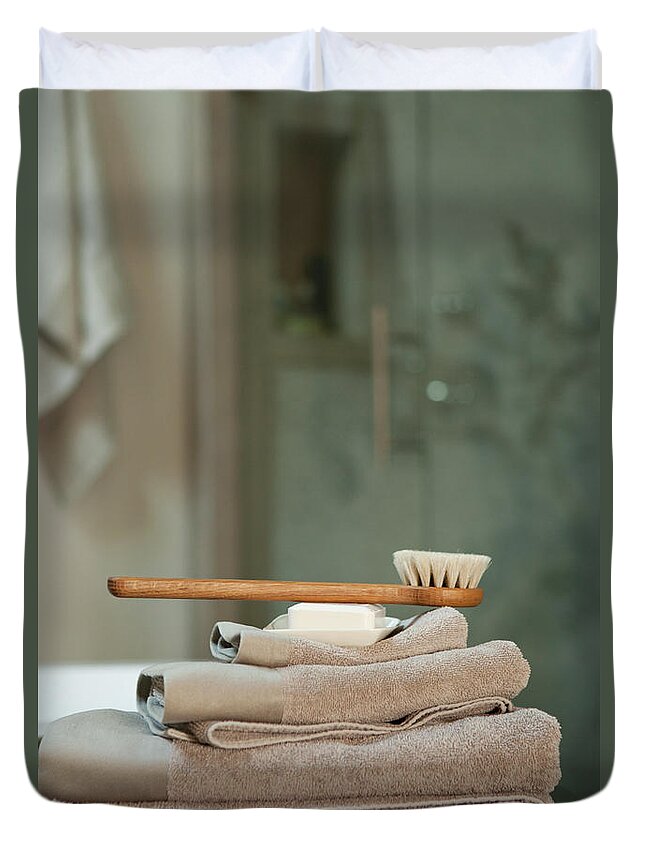 Toothbrush Duvet Cover featuring the photograph Bath Brush On Stacked Towels by Karyn R. Millet