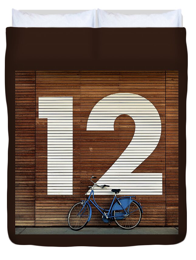 Leaning Duvet Cover featuring the photograph Bike Against Big 12 by Sebastian Steiner