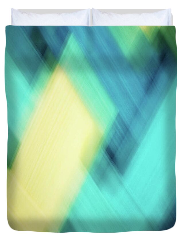 Abstract Duvet Cover featuring the photograph Bright blue, turquoise, green and yellow blurred diamond shapes abstract by Teri Virbickis