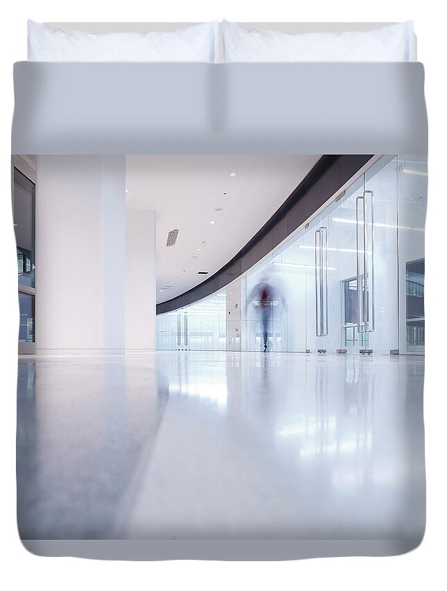 Mature Adult Duvet Cover featuring the photograph Businessmen Walking In A Modern Interior by Beijingstory