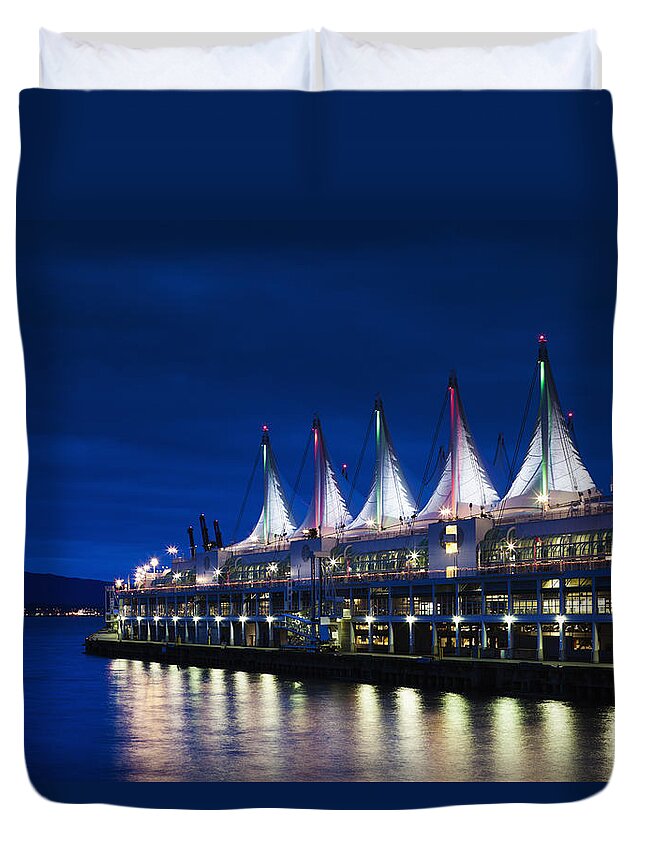Dawn Duvet Cover featuring the photograph Canada Place by Walter Bibikow