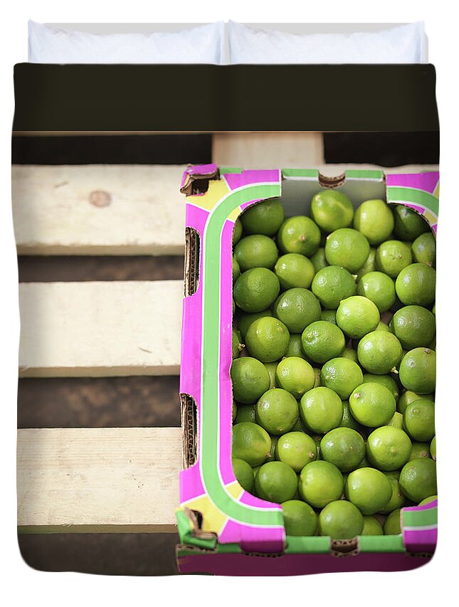 Bradford Duvet Cover featuring the photograph Close Up Of Box Of Limes by Monty Rakusen