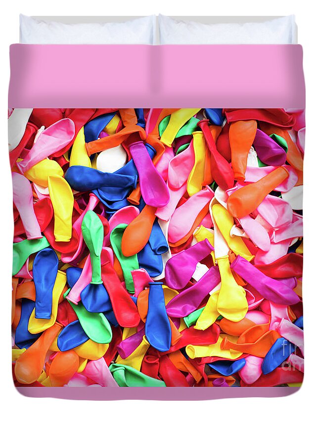 Abstract Duvet Cover featuring the photograph Close-up of many colorful children's balloons, background for mo by Joaquin Corbalan