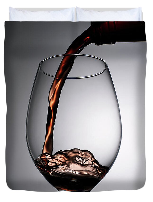 Alcohol Duvet Cover featuring the photograph Close Up Of Red Wine Being Poured Into by Johner Images