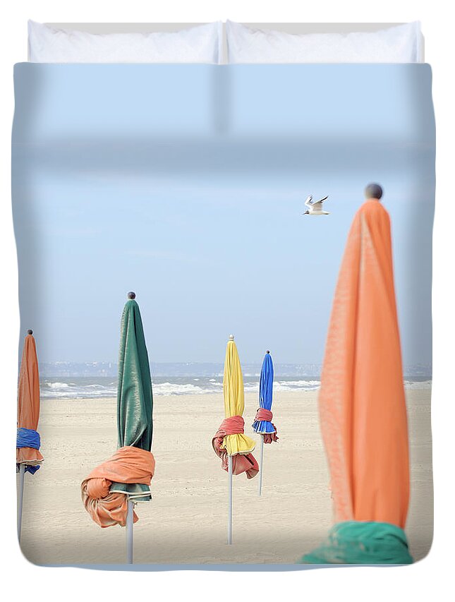Material Duvet Cover featuring the photograph Closed Sunshades On Beach by Eschcollection