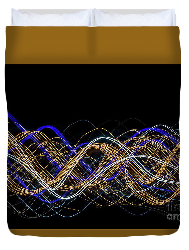 Abstract Duvet Cover featuring the photograph Colorful light painting with circular shapes and abstract black background. by Joaquin Corbalan