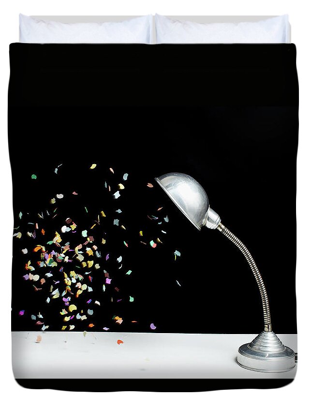 Event Duvet Cover featuring the photograph Confetti Floating Next To A Table Lamp by Benne Ochs