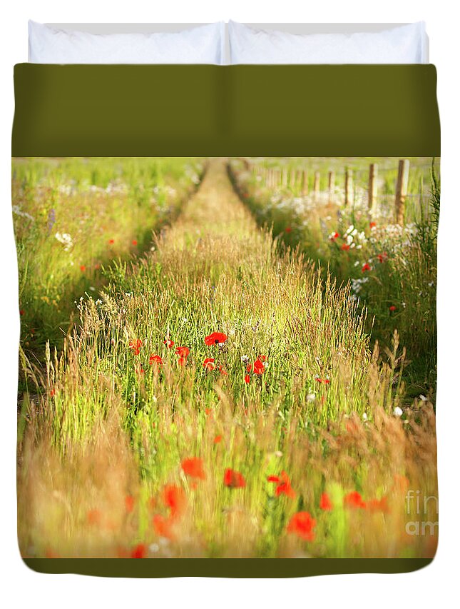 Converging Duvet Cover featuring the photograph Converging tracks in a flower meadow by Simon Bratt