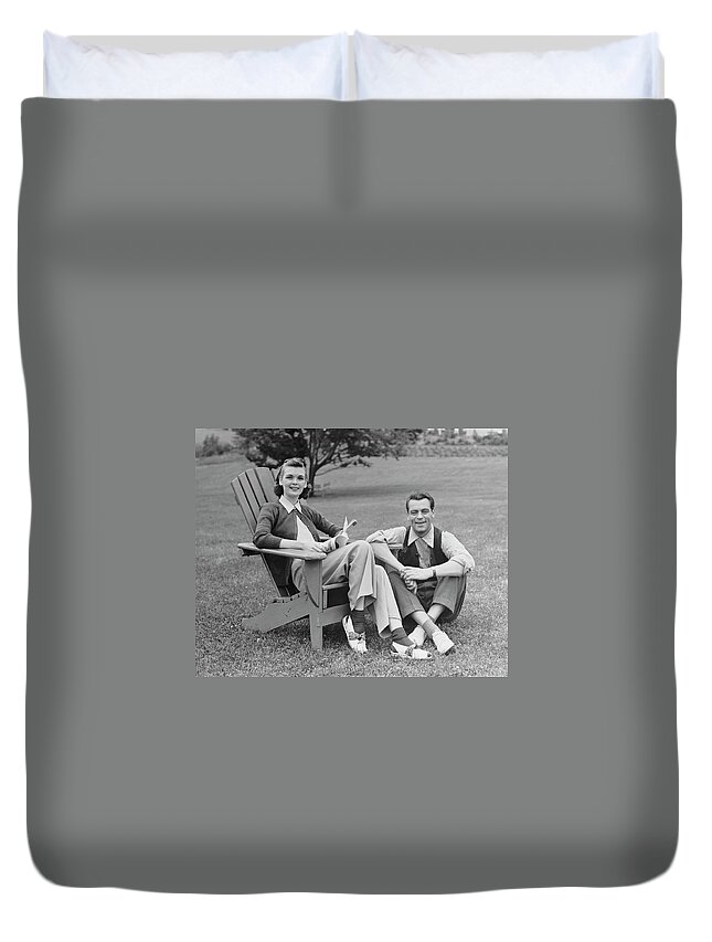 Heterosexual Couple Duvet Cover featuring the photograph Couple Sitting Outdoors by George Marks
