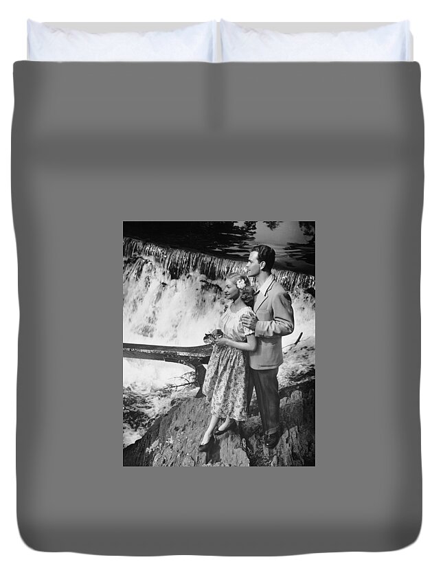 Heterosexual Couple Duvet Cover featuring the photograph Couple Standing Near Waterfall by George Marks