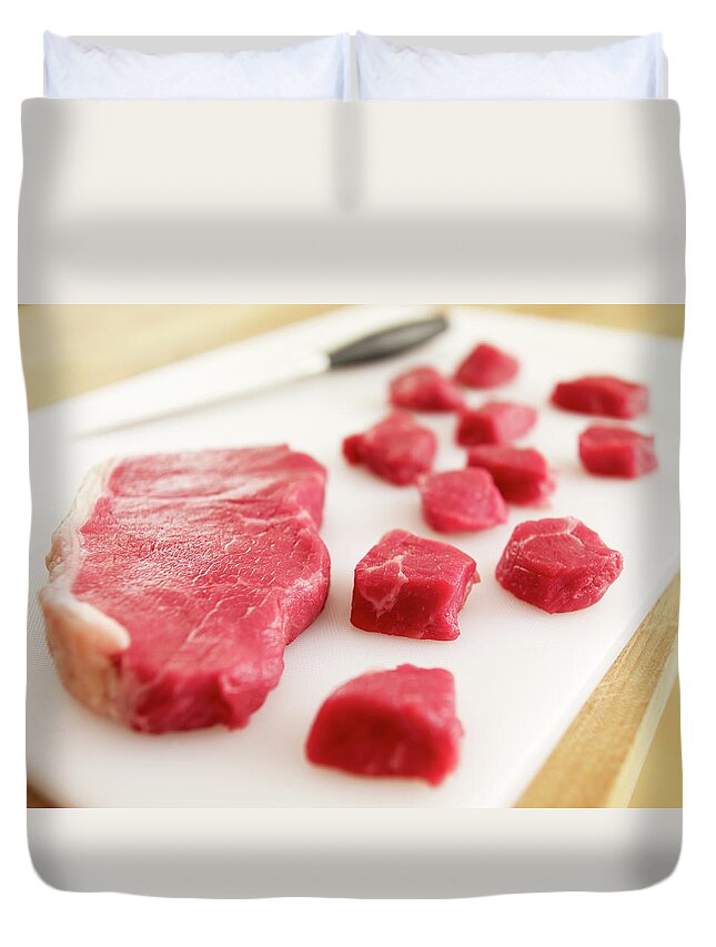 Cutting Board Duvet Cover featuring the photograph Cubed Raw Steak On Cutting Board by Adam Gault