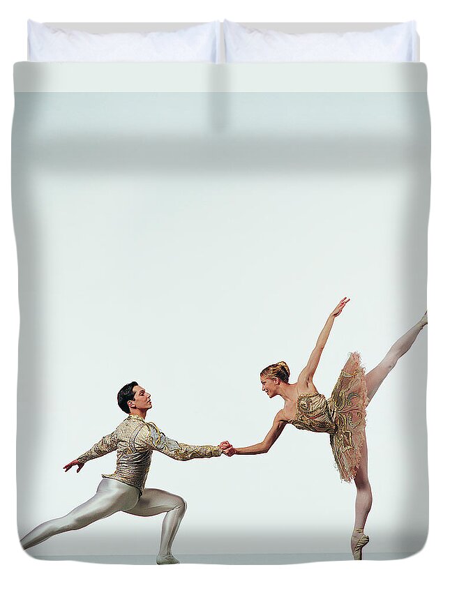 Young Men Duvet Cover featuring the photograph Female Ballerina Holding Hands With A by Chris Nash