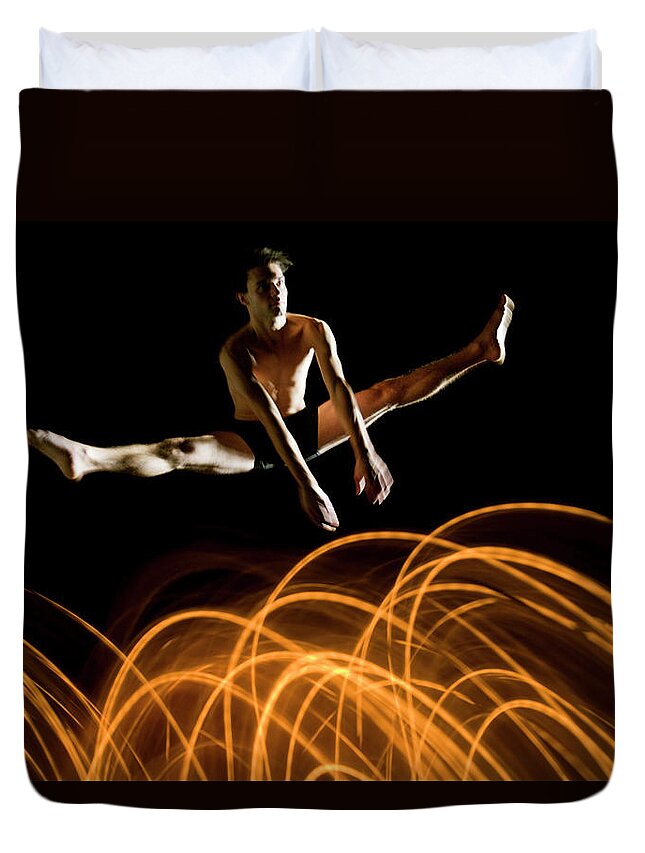Ballet Dancer Duvet Cover featuring the photograph Flexible Dancer Jumps Over Abstract by John Rensten