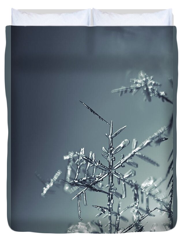 Abstract Duvet Cover featuring the photograph Fragile snowflake - monochrome blue by Intensivelight