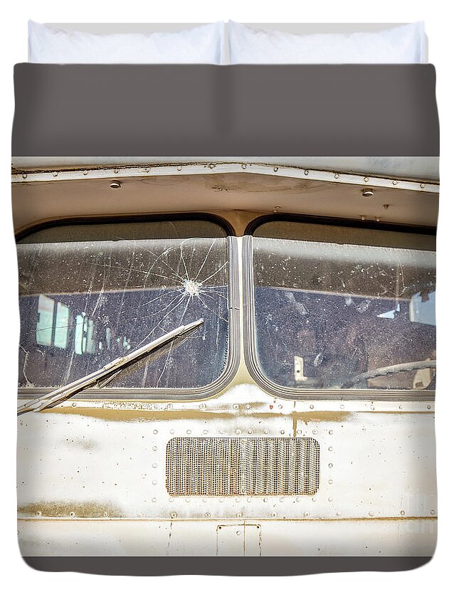 Junkyard Duvet Cover featuring the photograph Front of an old Bus in a junkyard by Edward Fielding