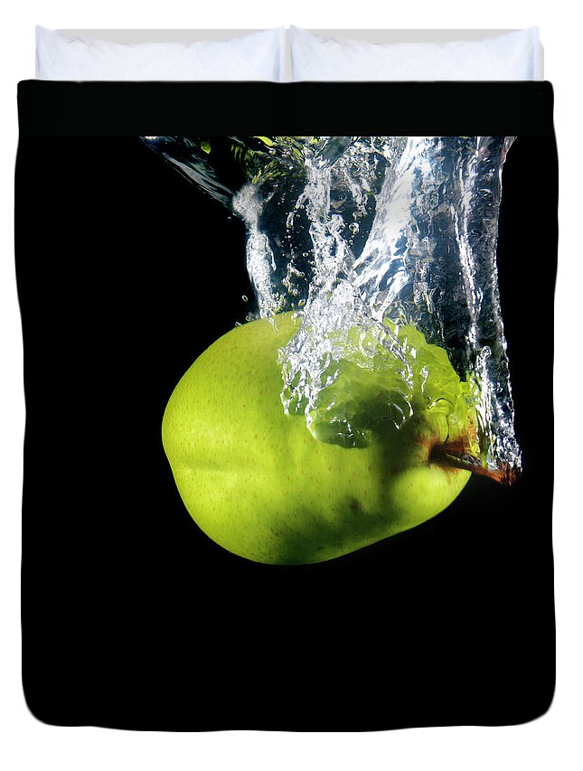 Black Background Duvet Cover featuring the photograph Green Pear Sinking In Water by Henrik Sorensen